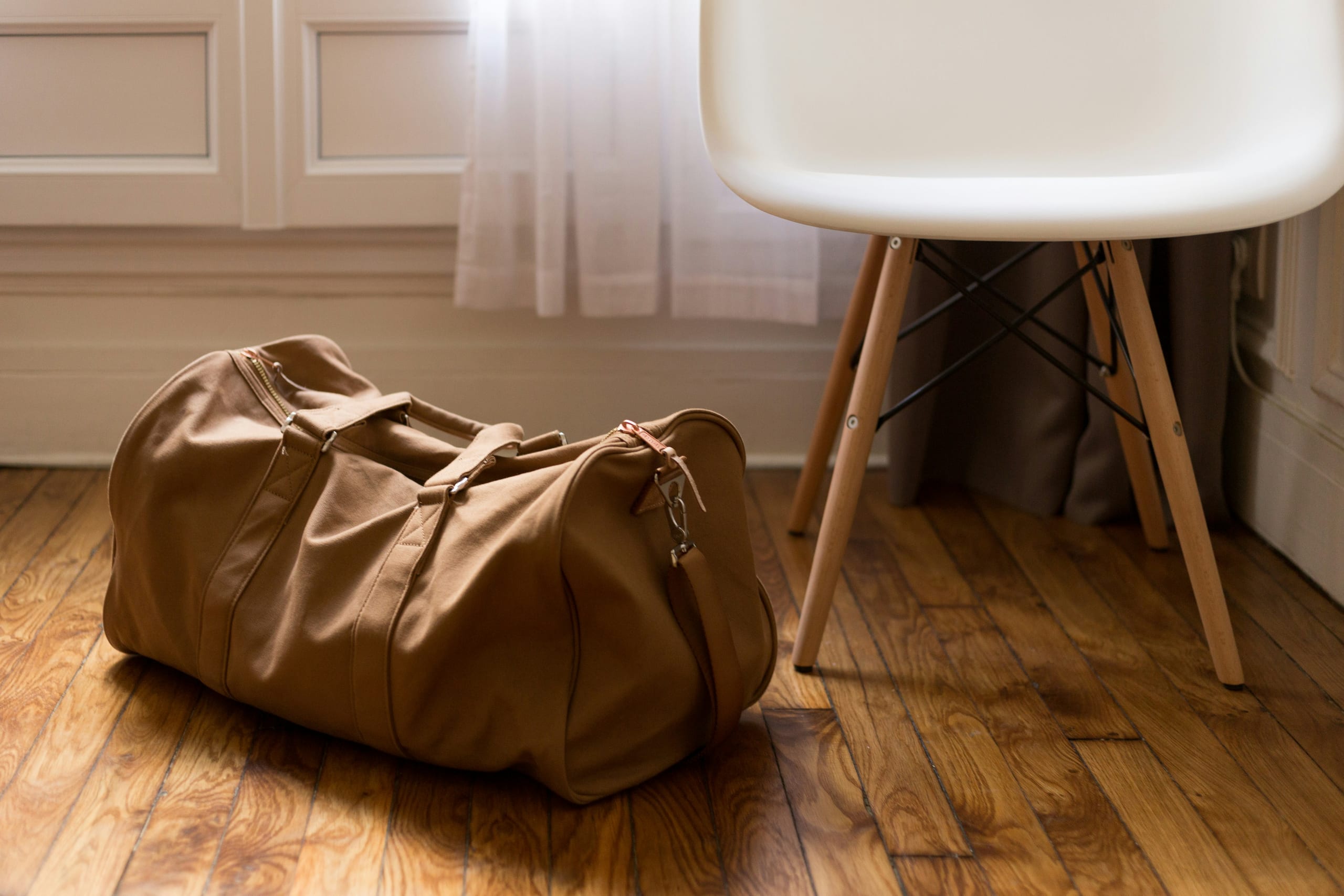 Haul Team Duffel 75 L — 75-litre team duffel in 900D polyester with a vented boot pocket and padded shoulder strap.