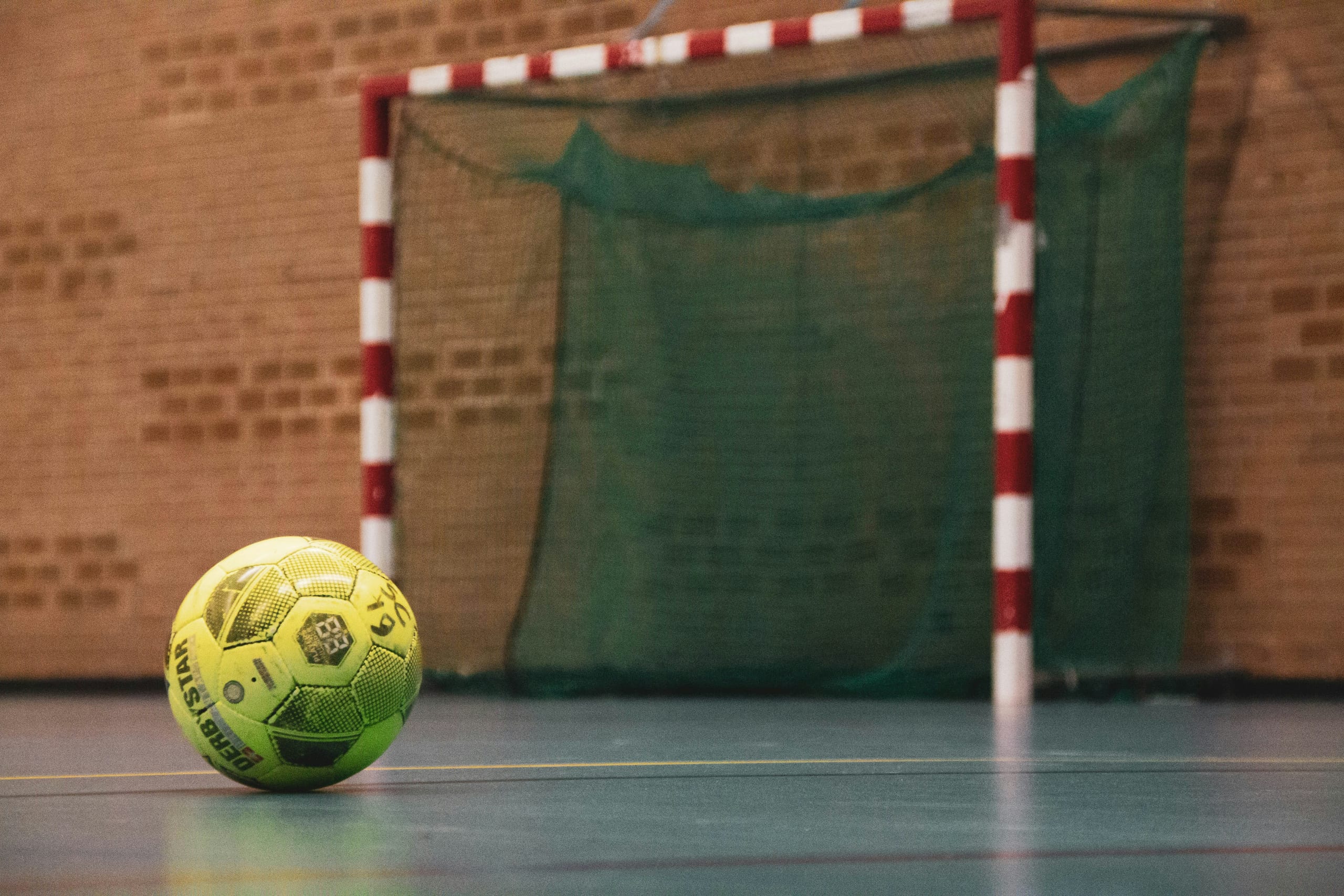 Court Low-Bounce Futsal Ball — Size 4 low-bounce futsal ball with a foam-backed cover for controlled indoor play.